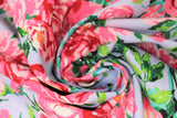 Swirled swatch berkshire garden fabric (pale grey/blue fabric with subtle stripe and large tossed pink and red floral bouquets with greenery allover)