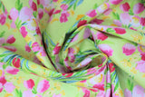 Swirled swatch fruitful pleasures fabric (lime green fabric with tulip bouquets repeated allover in pinks and yellows with green stems)