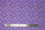 Flat swatch daisies purple fabric (pale purple fabric with small tossed white daisies allover with dark orange centers and brown/maroon coloured stems)