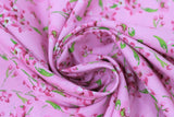Swirled swatch tulips and lilies pink fabric (light pink fabric with medium sized tossed pink tulips and lilies with green stems)