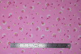 Flat swatch lilies and dandelions pink fabric (light pink fabric with small tossed white and pink lilies and dandelions allover)