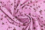 Swirled swatch daisies pink fabric (bright pink fabric with small tossed white daisies allover with dark red/orange centers and brown/maroon stems)