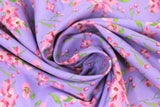 Swirled swatch tulips and lilies purple fabric (medium purple fabric with tossed pink/white tulips and lilies allover with green stems)