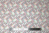 Flat swatch glam themed fabric in Colourful Word Collage on White