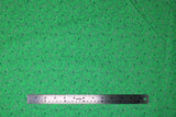 Flat swatch Green Flowers fabric (green fabric with tossed thin wispy floral stems and heads in white and green shades)