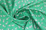 Swirled swatch green fabric (green fabric with tiny white cartoon/illustrative style mice tossed allover)