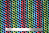 Flat swatch 3D Blocks fabric (3D cubes allover with coloured faces in green, blue, red, ombre style stripes with black faces on one side)