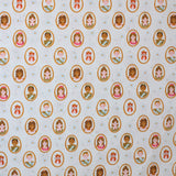 Square swatch Guinevere fabric (palest turquoise and white striped background with cartoon princes, princesses, and orange cats all wearing crowns within gold oval frames allover)