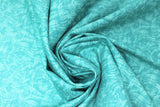 Swirled swatch green fabric (turquoise green fabric with dark turquoise paint like impressions/strokes)