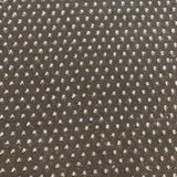 Swatch of black fabric with regular rows of tiny black latex dots.