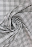 Swirled swatch fabric in Light Grey & White Plaid