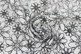 Swirled swatch flowers fabric (white fabric with large black floral head outlines allover)