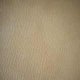 Square swatch faux leather look upholstery fabric in shade tan (beige)