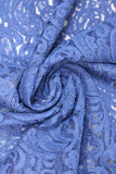 Swirled swatch of blue lace fabric