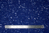 Flat swatch of blue lace fabric