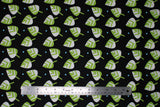 Flat swatch leaves fabric (black fabric with tossed green and white cartoon style leaves with blue polka dots)