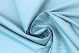Swirled swatch around the roses fabric (turquoise blue fabric with small teal and white lines in a diagonal/crossing pattern)