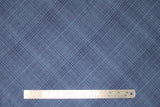 Flat swatch hey mister fabric (dark blue fabric with medium blue diagonally crossing lines allover)