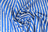 Swirled swatch let them be little fabric (deep blue fabric with thin white stripes with scalloped cloud-like shape tops)