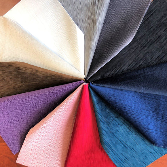 Group swatch textured velvet fabric in various colours arranged in a wheel of swatches