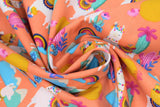 Swirled swatch orange fabric (orange fabric with busy tossed cacti in various styles and colours, and tossed white llamas with colourful decorative saddles, tossed blue mountains and coloured rainbows, etc.)