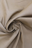 Swirled swatch of cotton solid in tan