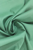 Swirled swatch of cotton solid in emerald