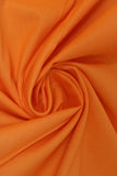 Swirled swatch of cotton solid in neon orange