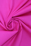 Swirled swatch of cotton solid in hot pink