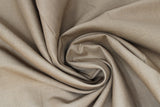 Swirled swatch of cotton solid in bronze (brown)