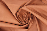 Swirled swatch of cotton solid in copper