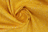 Swirled swatch constellations printed fabric in yellow (yellow/gold coloured fabric with small constellation star lines in gold and white tossed allover)