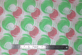 Flat swatch blotches printed fabric in white (white fabric with pink, light green, and white coloured circular blotches collage)