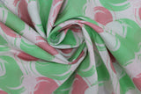 Swirled swatch blotches printed fabric in white (white fabric with pink, light green, and white coloured circular blotches collage)