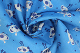 Swirled swatch cartoon chicks printed fabric in blue (medium blue fabric with occasional dark blue polka dots and blue cartoon baby chickens tossed allover)