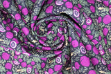 Swirled swatch food printed fabric in figs (black) (black fabric with tossed purple figs and doodled bubbles/greenery)