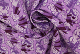 Swirled swatch crystals and peonies printed fabric in purple (medium purple fabric with tossed light purple peonies and dark purple crystal clusters tossed allover)