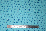 Flat swatch crystals printed fabric in blue (light blue fabric with tossed cartoon crystal clusters in blue shades)