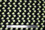 Flat swatch small leaves printed fabric in black (black fabric with tossed cartoon white/green leaves and small occasional white polka dots)