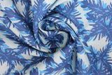 Swirled swatch big leaves printed fabric in blue (light blue fabric with medium and dark blue leafy pattern allover)