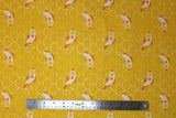Flat swatch cartoon fish and scales printed fabric in yellow (yellow fabric with white scale/scalloped pattern with tossed white and yellow/orange coy style fish)