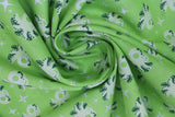 Swirled swatch of sea life fabric in octopus (green) (lime green fabric with tossed white shining stars, and pale green octopi small)