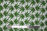 Flat swatch of pot leaf print fabric on white
