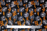 Flat swatch of assorted Canadian custom motorcycles fabric in black (black fabric with tossed logo and text related to Canadian custom motorcycles "Custom" text, etc. in white, orange)