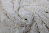 Swirled swatch of faux fur fabric in white
