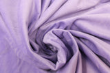 Swirled swatch of faux fur fabric in light purple