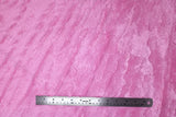 Flat swatch of faux fur fabric in light pink