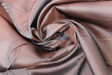 Swirled swatch of polyester lining in dark brown