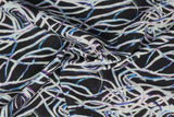 Print "Maze of Mystery" from the Spirit Winds collection, twisted to show fabric drape and texture.
