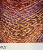 Swatch of Marble Chunky yarn in shade MC91 (orange and brown, purple and orange shades with twists)
